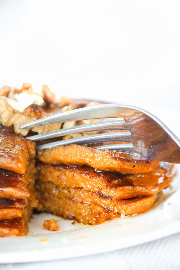 Sweet potato pancakes drizzled with maple syrup